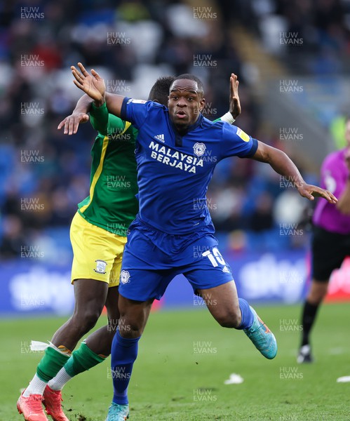 120322 Cardiff City v Preston North End, Sky Bet Championship - Uche Ikpeazu of Cardiff City tangles with Bambo Diary of Preston North End as he looks to win the ball