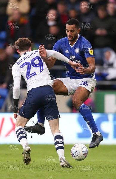 211219 - Cardiff City v Preston North End, Sky Bet Championship - Curtis Nelson of Cardiff City and Tom Barkhuizen of Preston North End compete for the ball