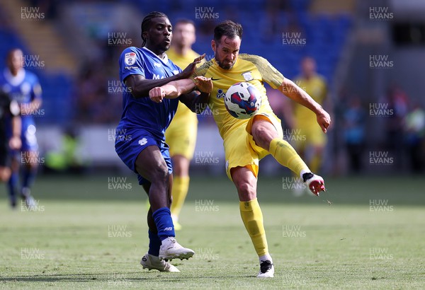 270822 - Cardiff City v Preston North End - SkyBet Championship - Sheyi Ojo of Cardiff City is challenged by Greg Cunningham of Preston North End