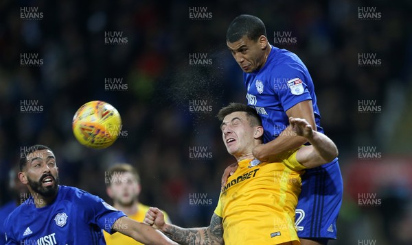 291217 - Cardiff City v Preston North End - SkyBet Championship - Lee Peltier of Cardiff City and Jordan Hugill of Preston North End go up for the ball