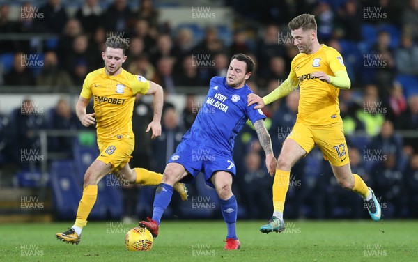 291217 - Cardiff City v Preston North End - SkyBet Championship - Lee Tomlin of Cardiff City is challenged by Alan Browne and Paul Gallagher of Preston North End
