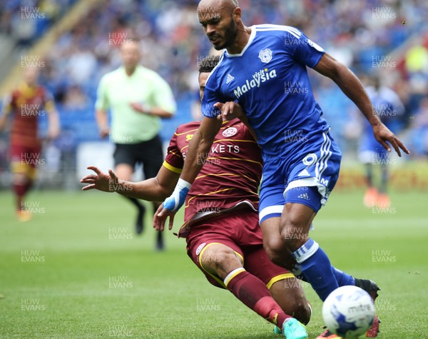 140816 - Cardiff City v Queens Park Rangers, Football League Championship - Frederic Gounongbe of Cardiff City is challenged by Steven Caulker of Queens Park Rangers