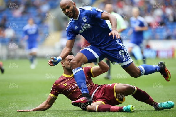 140816 - Cardiff City v Queens Park Rangers, Football League Championship - Frederic Gounongbe of Cardiff City is challenged by Steven Caulker of Queens Park Rangers