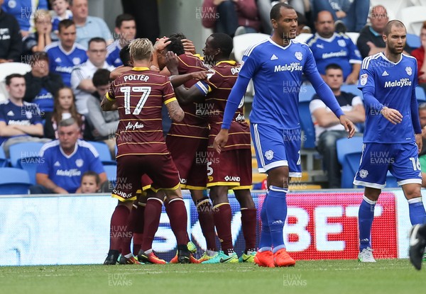 140816 - Cardiff City v Queens Park Rangers, Football League Championship - Queens Park Rangers players celebrate after Steven Caulker of Queens Park Rangers scores goal