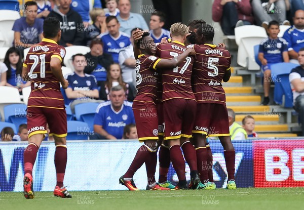 140816 - Cardiff City v Queens Park Rangers, Football League Championship - Queens Park Rangers players celebrate after Steven Caulker of Queens Park Rangers scores goal