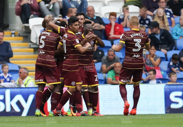 140816 - Cardiff City v Queens Park Rangers, Football League Championship - Queens Park Rangers players celebrate after Steven Caulker of Queens Park Rangers scores goal