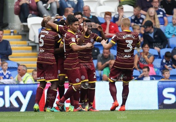 140816 - Cardiff City v Queens Park Rangers, Football League Championship - Queens Park Rangers players celebrate after Steven Caulker of Queens Park Rangers scores goal