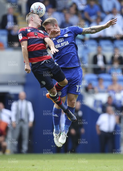 260817 - Cardiff City v Queens Park Rangers, Sky Bet Championship - Josh Scowen of Queens Park Rangers and Aron Gunnarsson of Cardiff City compete for the ball