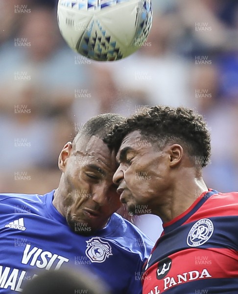 260817 - Cardiff City v Queens Park Rangers, Sky Bet Championship - Kenneth Zohore of Cardiff City and Darnell Furlong of Queens Park Rangers clash heads as they compete for the ball