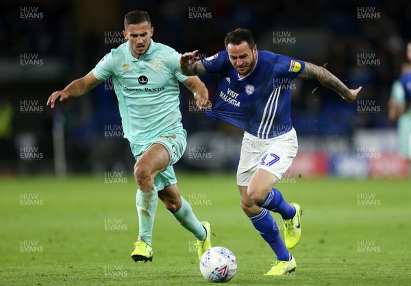 021019 - Cardiff City v Queens Park Rangers - SkyBet Championship - Lee Tomlin of Cardiff City is pulled back by Dominic Ball of QPR