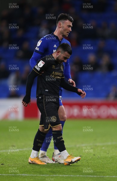 031121 - Cardiff City v Queens Park Rangers, Sky Bet Championship - Kieffer Moore of Cardiff City helps Ilias Chair of Queens Park Rangers to his feet and to the edge of the pitch after he received treatment for an injury