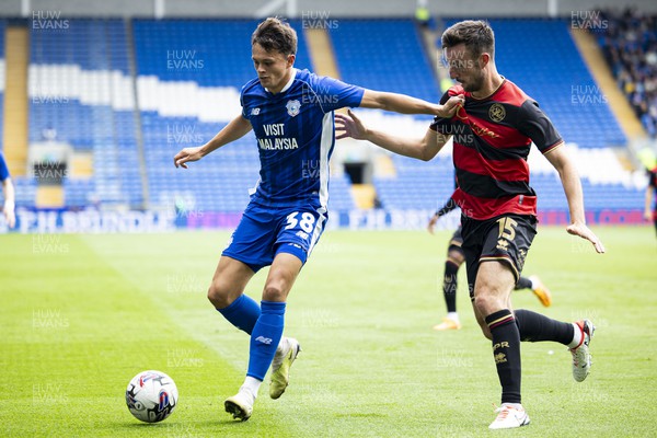 120823 - Cardiff City v Queens Park Rangers - Sky Bet Championship - Perry Ng of Cardiff City in action against Morgan Fox of Queens Park Rangers