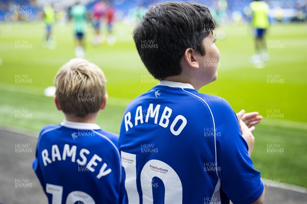 120823 - Cardiff City v Queens Park Rangers - Sky Bet Championship - Young Cardiff City supporters wearing Aaron Ramsey shirts ahead of kick off