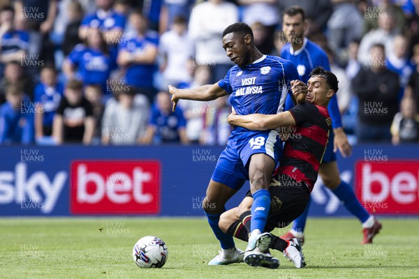120823 - Cardiff City v Queens Park Rangers - Sky Bet Championship - Ebou Adams of Cardiff City is fouled by Andre Dozzell of Queens Park Rangers