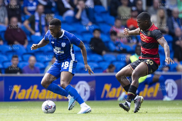 120823 - Cardiff City v Queens Park Rangers - Sky Bet Championship - Ebou Adams of Cardiff City in action against Sinclair Armstrong of Queens Park Rangers