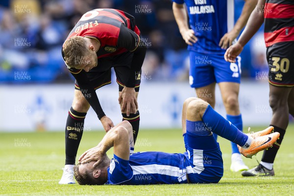 120823 - Cardiff City v Queens Park Rangers - Sky Bet Championship - Jake Clarke-Salter of Queens Park Rangers apologises after fouling Aaron Ramsey of Cardiff City