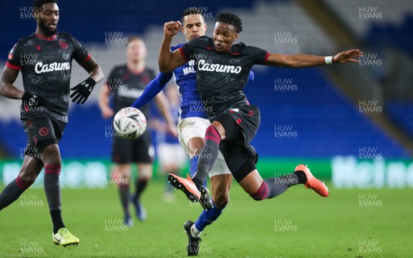 040220 - Cardiff City v Reading, FA Cup Round 4 Replay - Gabriel Osho of Reading flies in to rob Robert Glatzel of Cardiff City of the ball