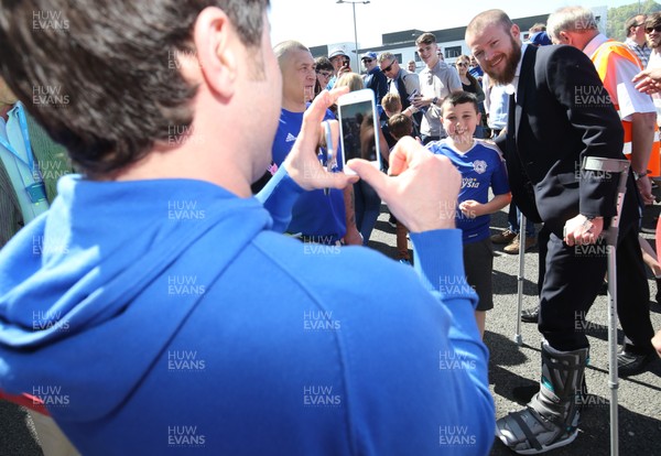 060518 - Cardiff City v Reading, Sky Bet Championship - Injured Aron Gunnarsson of Cardiff City poses for photographs with fans at Cardiff City Stadium ahead of the match