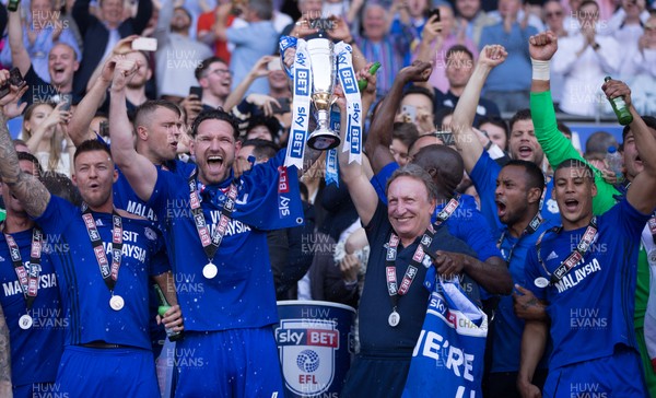 060518 - Cardiff City v Reading, Sky Bet Championship - Sean Morrison of Cardiff City and Cardiff City manager Neil Warnock celebrate with the team after winning promotion to the Premier League