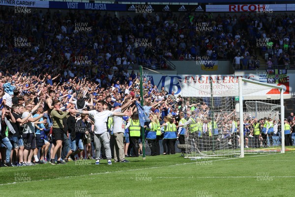 060518 - Cardiff City v Reading, Sky Bet Championship - Cardiff City fans run onto the pitch to celebrate winning promotion to the Premier League