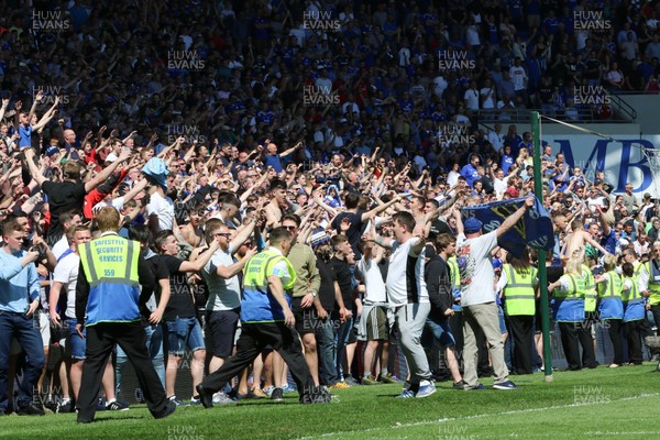 060518 - Cardiff City v Reading, Sky Bet Championship - Cardiff City fans run onto the pitch to celebrate winning promotion to the Premier League