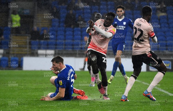 170223 - Cardiff City v Reading - EFL SkyBet Championship - Amadou Mbengue of Reading is tackled by Mark McGuinness of Cardiff City leading to a yellow card