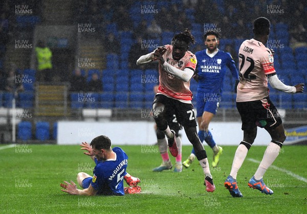 170223 - Cardiff City v Reading - EFL SkyBet Championship - Amadou Mbengue of Reading is tackled by Mark McGuinness of Cardiff City leading to a yellow card