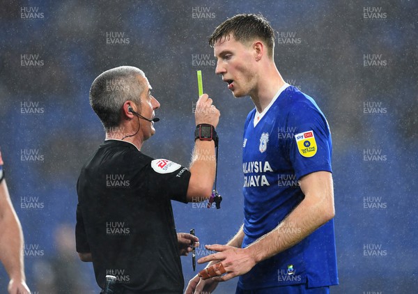 170223 - Cardiff City v Reading - EFL SkyBet Championship - Mark McGuinness of Cardiff City is shown a yellow card by Referee Darren Bond