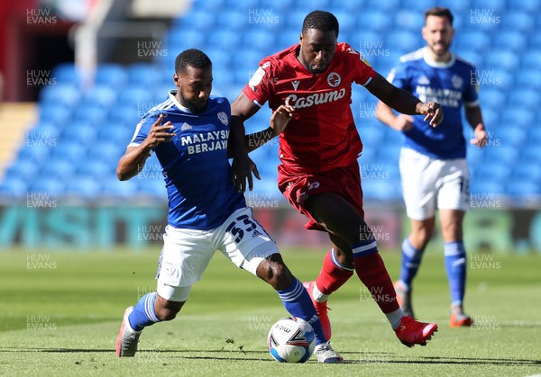 260920 - Cardiff City v Reading - SkyBet Championship - Junior Hoilett of Cardiff City is challenged by Yakou Meite of Reading