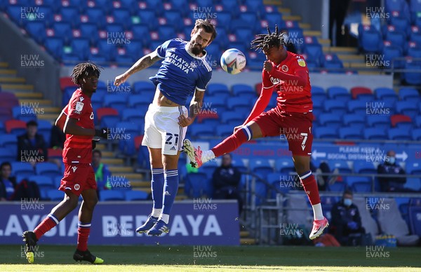260920 - Cardiff City v Reading - SkyBet Championship - Marlon Pack of Cardiff City and Michael Olise of Reading go up for the ball