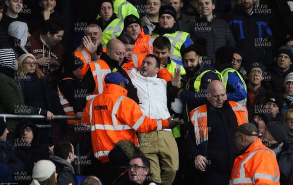 310120 - Cardiff City v Reading, Sky Bet Championship - A Reading fan is removed from the stand by stewards after complaints by Cardiff City fans