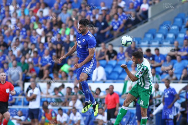 040818 - Cardiff City v Real Betis Balompie - Pre season Friendly -  Callum Paterson of Cardiff City and Javi Garcia of Real Betis compete for a high ball 