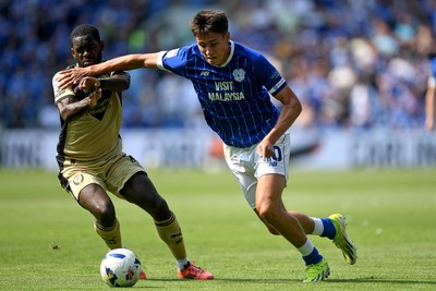 160825 - Cardiff City v Rotherham United - Sky Bet League 1 - Rubin Colwill of Cardiff City is challenged by Dru Yearwood of Rotherham United