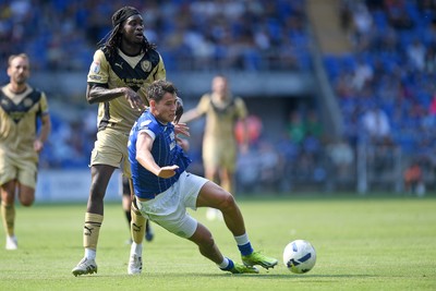 160825 - Cardiff City v Rotherham United - Sky Bet League 1 - Rubin Colwill of Cardiff City is challenged by Lenny Agbaire of Rotherham United