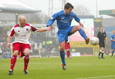 030104Cardiff City v Sheffield Utd, FA Cup 3rd round  Cardiff's Gareth Whalley controls the ball as Robert Page closes in  