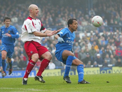 030104Cardiff City v Sheffield Utd, FA Cup 3rd round  Cardiff's Robert Earnshaw keeps his eye on the ball as Robert Page closes in  