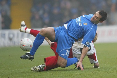 030104Cardiff City v Sheffield Utd, FA Cup 3rd round  Cardiff's Peter Thorne wins the ball from Robert Kozluk  