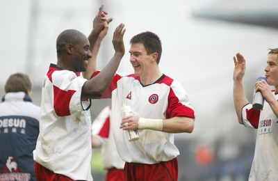 030104Cardiff City v Sheffield Utd, FA Cup 3rd round  Sheffield Utd's Wayne Allison (lt) and Chris Morgan celebrate the win  