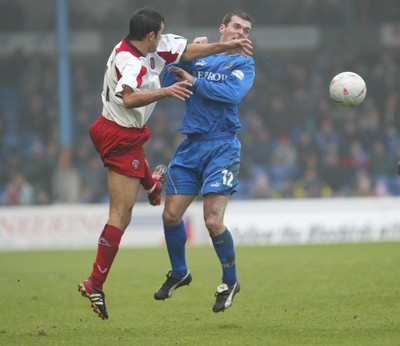 030104Cardiff City v Sheffield Utd, FA Cup 3rd round  Cardiff's Willie Boland clashes with Jack Lester  