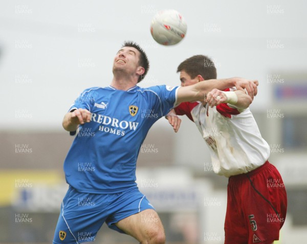 030104Cardiff City v Sheffield Utd, FA Cup 3rd round  Cardiff's Tony Vidmar heads past Chris Morgan 