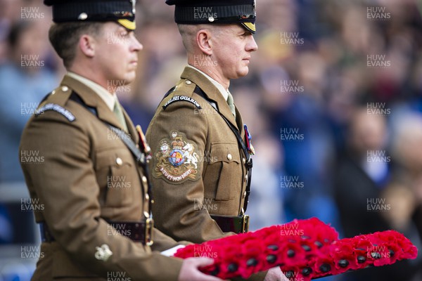 121122 - Cardiff City v Sheffield United - Sky Bet Championship - Members of The Welsh Guards lay wreaths ahead of kick off
