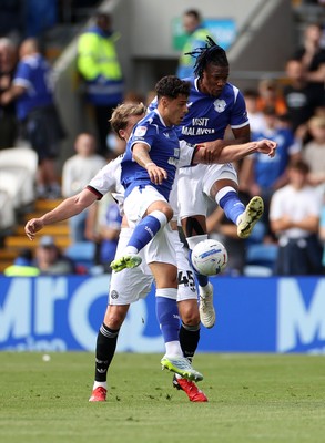 290826 - Cardiff City v Sheffield United - SkyBet Championship - Alex Robertson and Gabriel Osho of Cardiff City go for the ball over Patrick Bamford of Sheffield United 