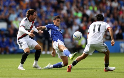 290826 - Cardiff City v Sheffield United - SkyBet Championship - Alex Robertson of Cardiff City is challenged by Joe Rothwell of Sheffield United 