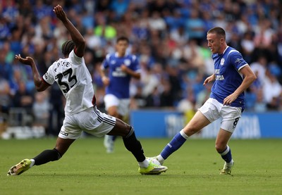 290826 - Cardiff City v Sheffield United - SkyBet Championship - Jack Moylan of Cardiff City is tackled by Jamal Baptiste of Sheffield United 