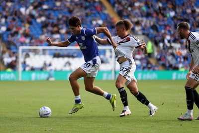 290826 - Cardiff City v Sheffield United - SkyBet Championship - Rubin Colwill of Cardiff City is challenged by Kalvin Phillips of Sheffield United 