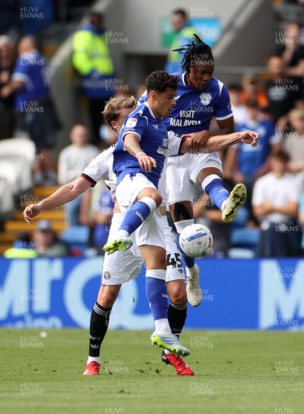 290826 - Cardiff City v Sheffield United - SkyBet Championship - Alex Robertson and Gabriel Osho of Cardiff City go for the ball over Patrick Bamford of Sheffield United 