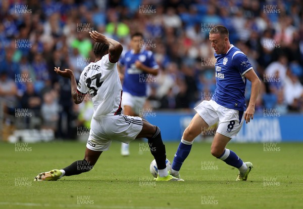 290826 - Cardiff City v Sheffield United - SkyBet Championship - Jack Moylan of Cardiff City is tackled by Jamal Baptiste of Sheffield United 