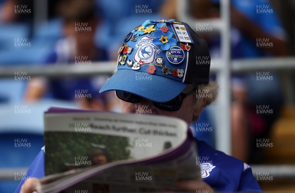 290826 - Cardiff City v Sheffield United - SkyBet Championship - A Cardiff fan reads the paper
