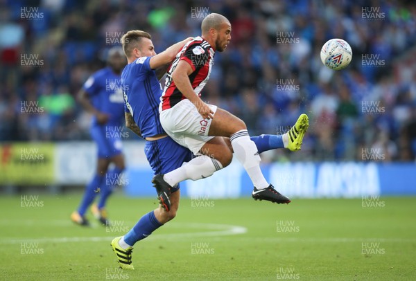 150817 - Cardiff City v Sheffield United, Sky Bet Championship - Joe Ralls of Cardiff City and John Fleck of Sheffield United compete for the ball