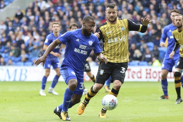 160917 - Cardiff City v Sheffield Wednesday, SkyBet Championship - Junior Hoilett of Cardiff City holds off the challenge from Daniel Pudil of Sheffield Wednesday